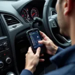 Mechanic using an Amazon car diagnostic tool on a car's OBD-II port