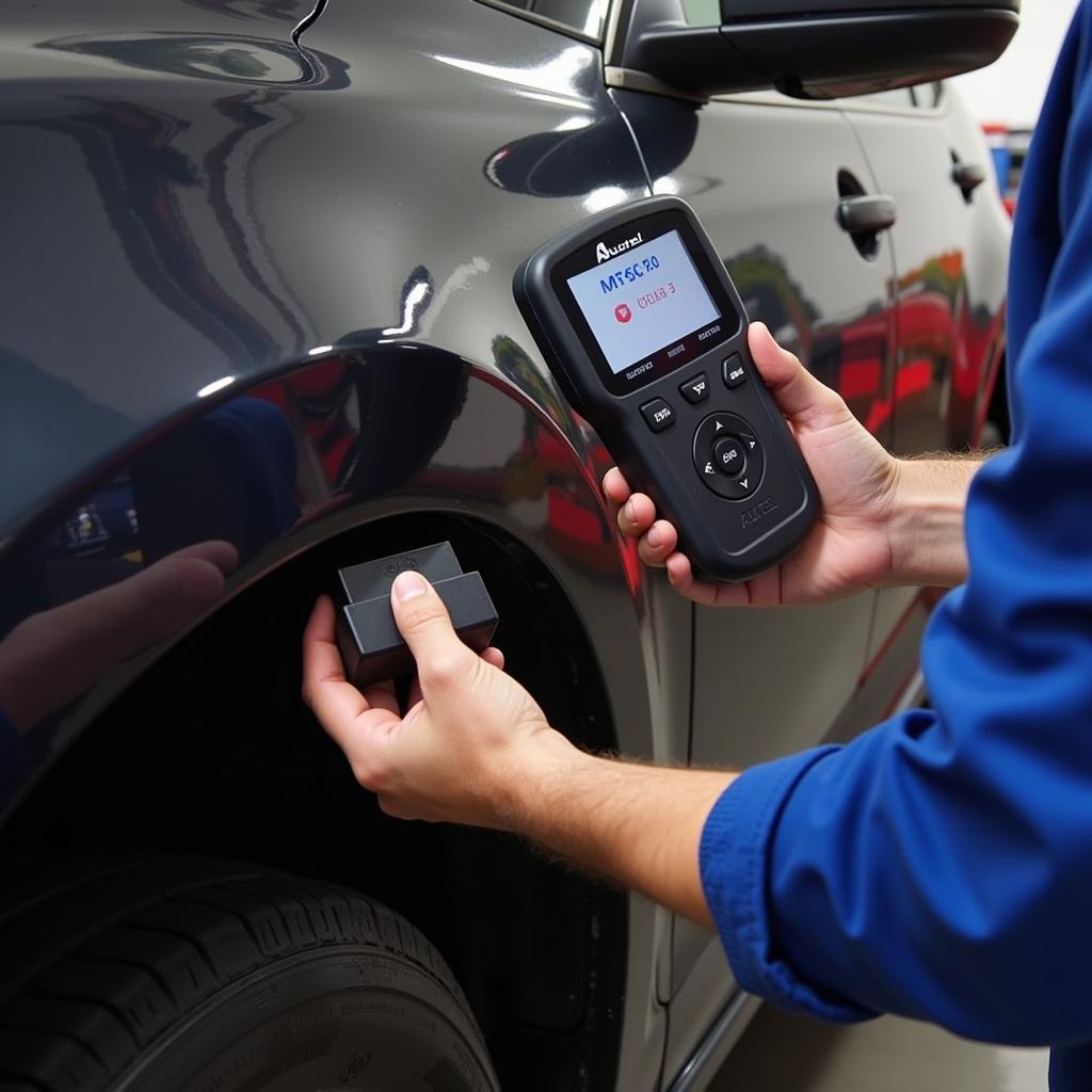 Mechanic Using an Autel Scanner