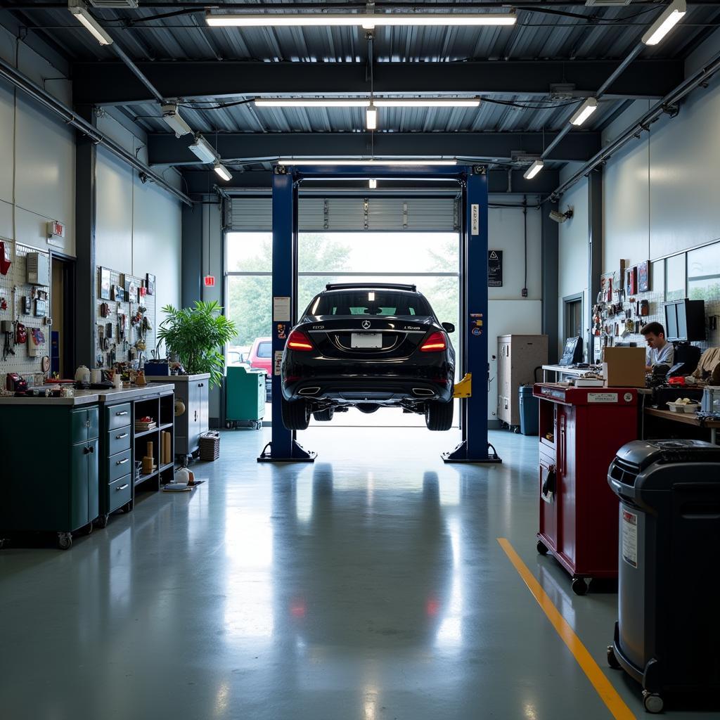 Car being serviced inside a well-equipped auto repair shop