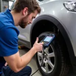 Mechanic using a diagnostic test tool on a car