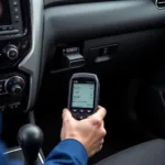 Mechanic Using a Car Diagnostic Scanner on a Vehicle