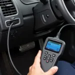 Mechanic Connecting Diagnostic Equipment