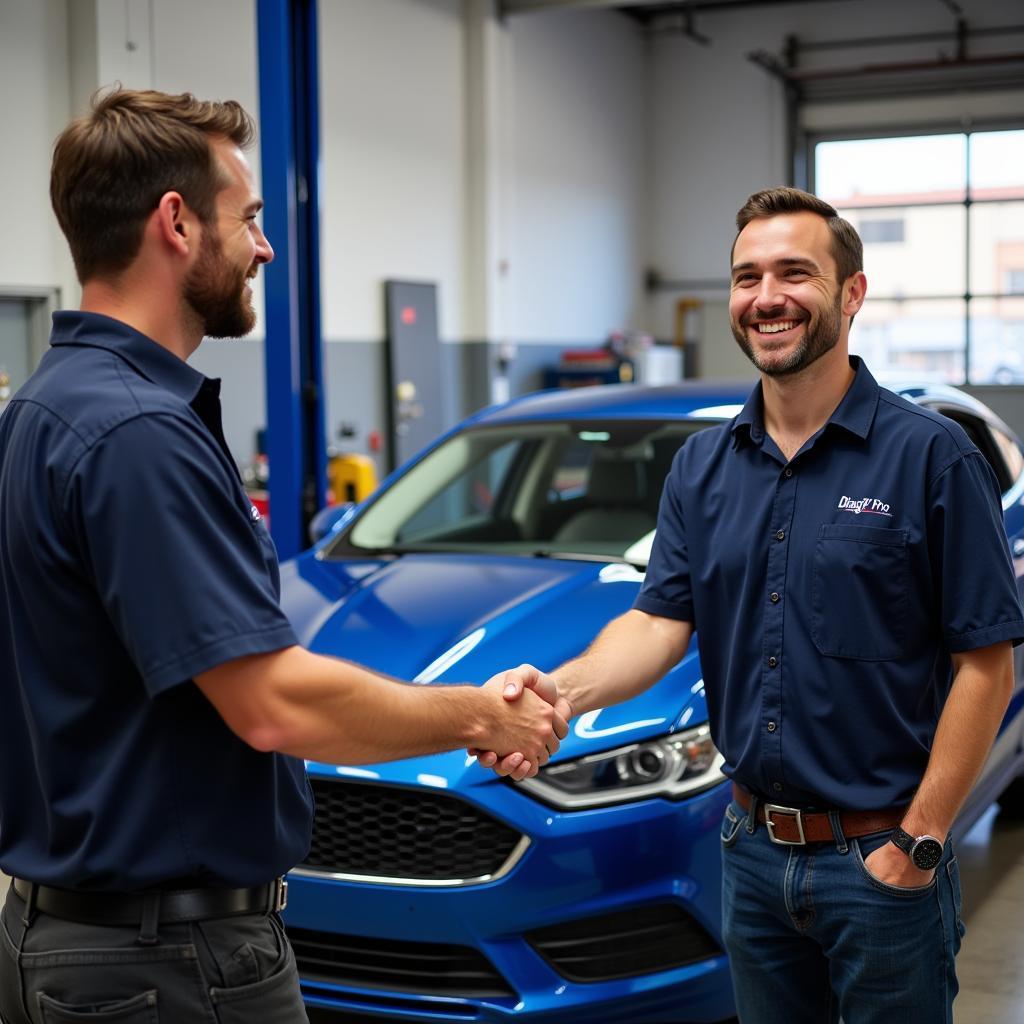 A satisfied Ford owner receiving their car keys from a technician after a successful car diagnostic and repair service