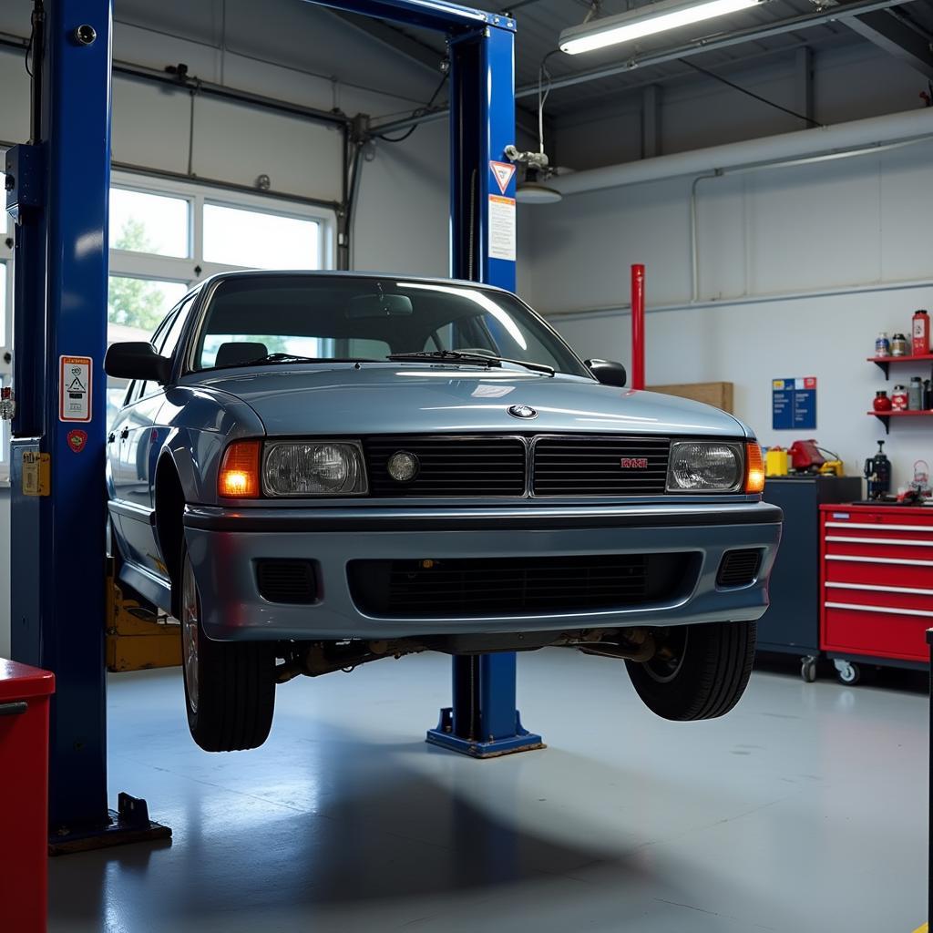 Car Lifted for Repairs in a Modern Workshop