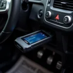 Car OBD Diagnostic Tool Connected to a Car