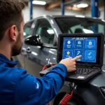 Mechanic using diagnostic equipment on a car