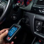 Mechanic using a diagnostic code reader on a car