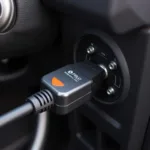 Fixd car diagnostic tool connected to car's OBD2 port