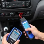 Mechanic plugging an OBD-II scanner into a car's diagnostic port