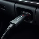 Gendan USB Diagnostic Tool connected to a car's OBD-II port