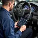 Mechanic using an iPad car diagnostic tool in a garage