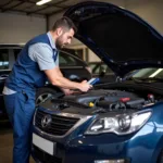 Mechanic troubleshooting a European car using a diagnostic tool