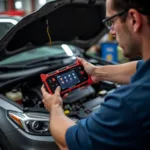 Mechanic Using a Diagnostic Tool