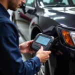 Mechanic Using OBD Scanner on Vehicle