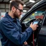 Mechanic Using Professional Car Diagnostic Scanner