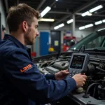 Mechanic Using U480 Scanner in Workshop