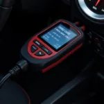 Car Fault Reader Connected to a Car