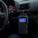 OBD2 Scanner Connected to Car