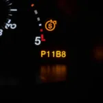 Car dashboard displaying the check engine light and P11B8 error code