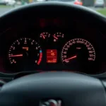 Peugeot 206 dashboard with the engine warning light illuminated