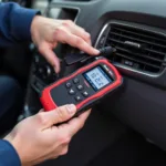 Mechanic using a streetwise car diagnostic meter