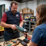 Tool hire employee demonstrating tool use