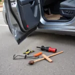 Broken Car Door Spring and Tools for Opening