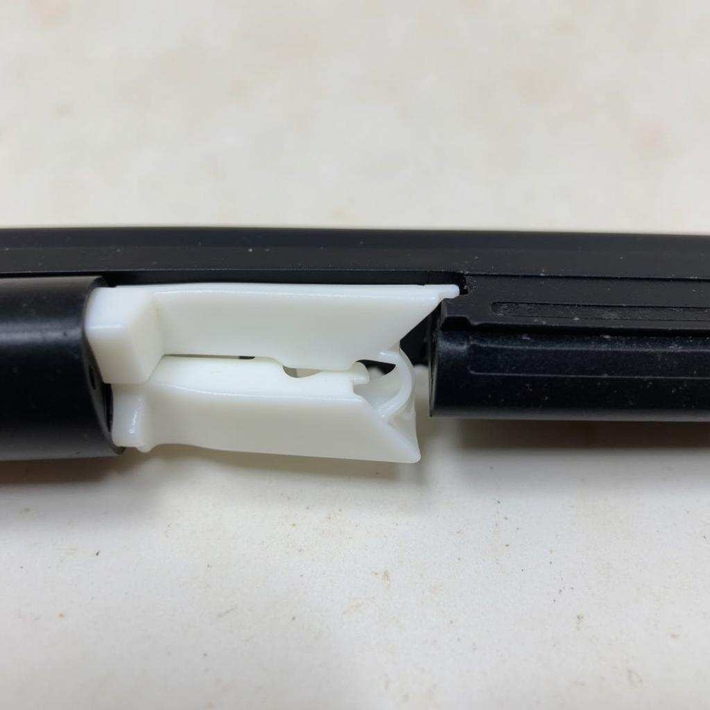 A broken plastic trim clip