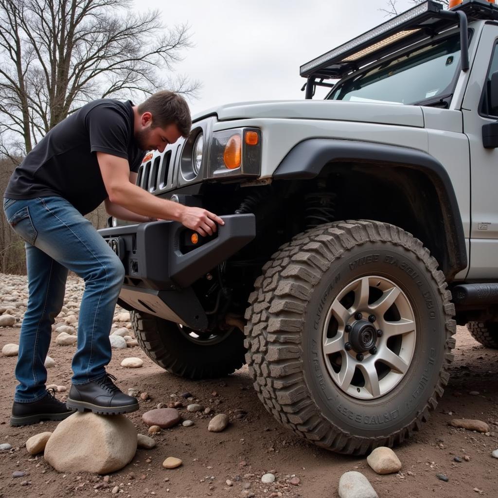 Repairing car body damage with miner tools in an off-road setting