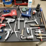 Car body repair tools available for hire, including dent pullers, sanders, and spray guns.