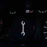 Car Dashboard Showing Maintenance Light