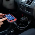 Car Diagnostic Tool - OBD-II Scanner plugged into a car's OBD-II port