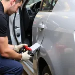 Using a Car Door Gap Repair Tool to Adjust Door Alignment