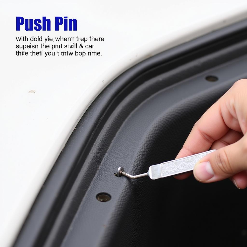 Using a car door panel push pin removal tool to safely extract a push pin.