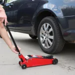 Lifting a Car with a Jack for Tire Removal