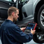 Mechanic Diagnosing P0442 Error Code with a Scan Tool