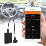 A smartphone connected to a car's OBD2 port via a diagnostic tool.