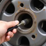 Removing a Car Valve Core Without a Tool