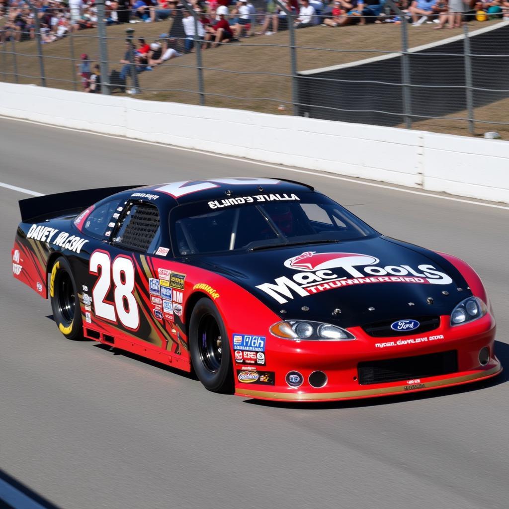 Davey Allison's #28 Mac Tools Ford Thunderbird racing on the track