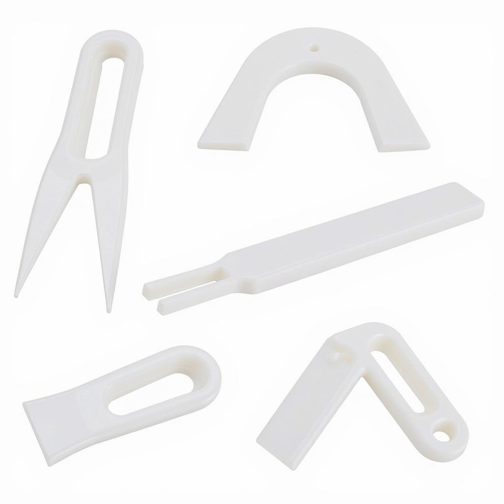 Various plastic pry tools, including straight, curved, and angled designs.