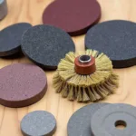 Dremel accessories for car paint removal: abrasive buffs, sanding drums, wire brushes, and grinding stones.