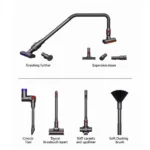 Dyson Car Cleaning Kit Tools: A close-up view of various attachments in a Dyson car cleaning kit, including a crevice tool, extension hose, stiff bristle brush, and soft dusting brush.