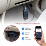 ELM327 Bluetooth scanner plugged into a car's OBD-II port