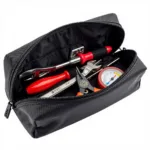 Essential car tools neatly organized inside a durable zip pouch, ready for roadside emergencies or quick fixes.