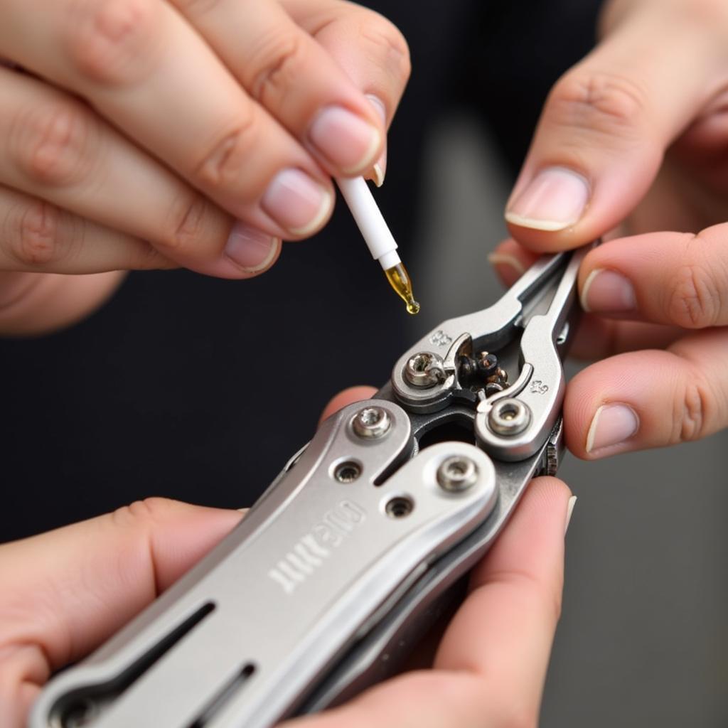 Applying lubricant to the joints and pivot points of a Leatherman multi-tool to ensure smooth operation.