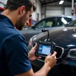 Mechanic Diagnosing a Car with a Diagnostic Tool