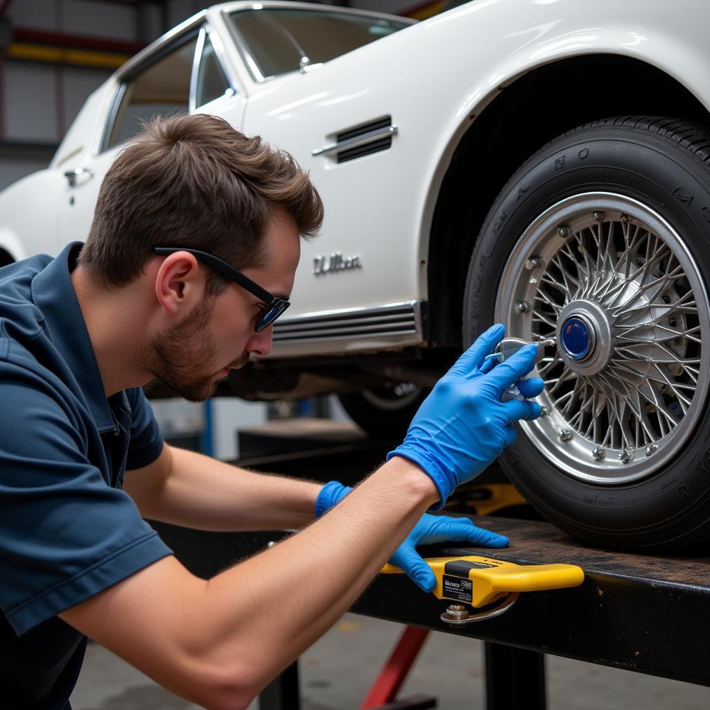 Mechanic Safely Using KMS Tools Car Rotisserie