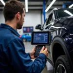 Mechanic Using Diagnostic Scanner Financed Through Euro Car Parts