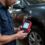 Mechanic Using a Diagnostic Tool on a Car