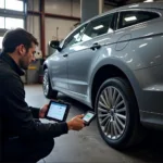 Mechanic Using a Diagnostic Tool on an American-Made Car